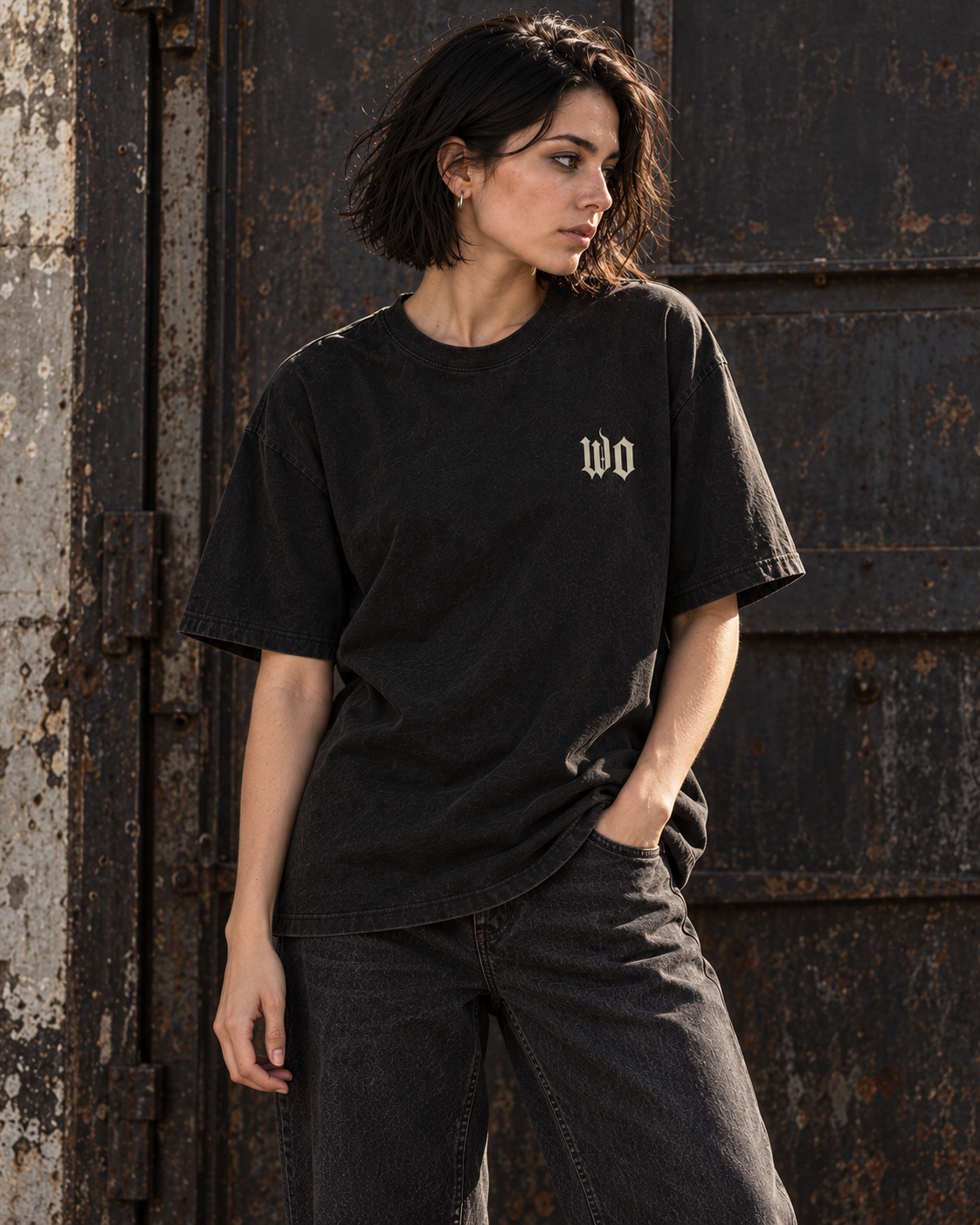Front view of Nocturne washed-black tee with a small bone WO on the left chest